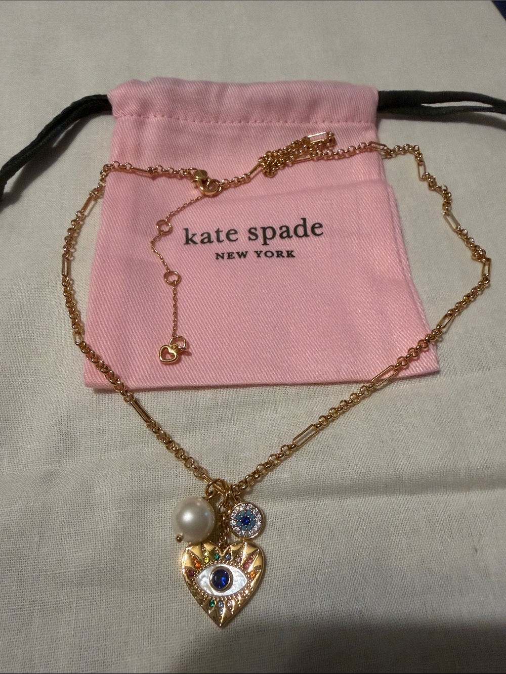 kate spade Gold-Tone Evil Eye Heart Necklace with Pink Pouch